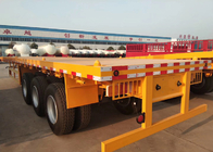 Κίτρινο επίπεδης βάσης 3 αξόνων φορτηγό ρυμουλκών εμπορευματοκιβωτίων ημι που φέρνει το βαρύ εξοπλισμό
